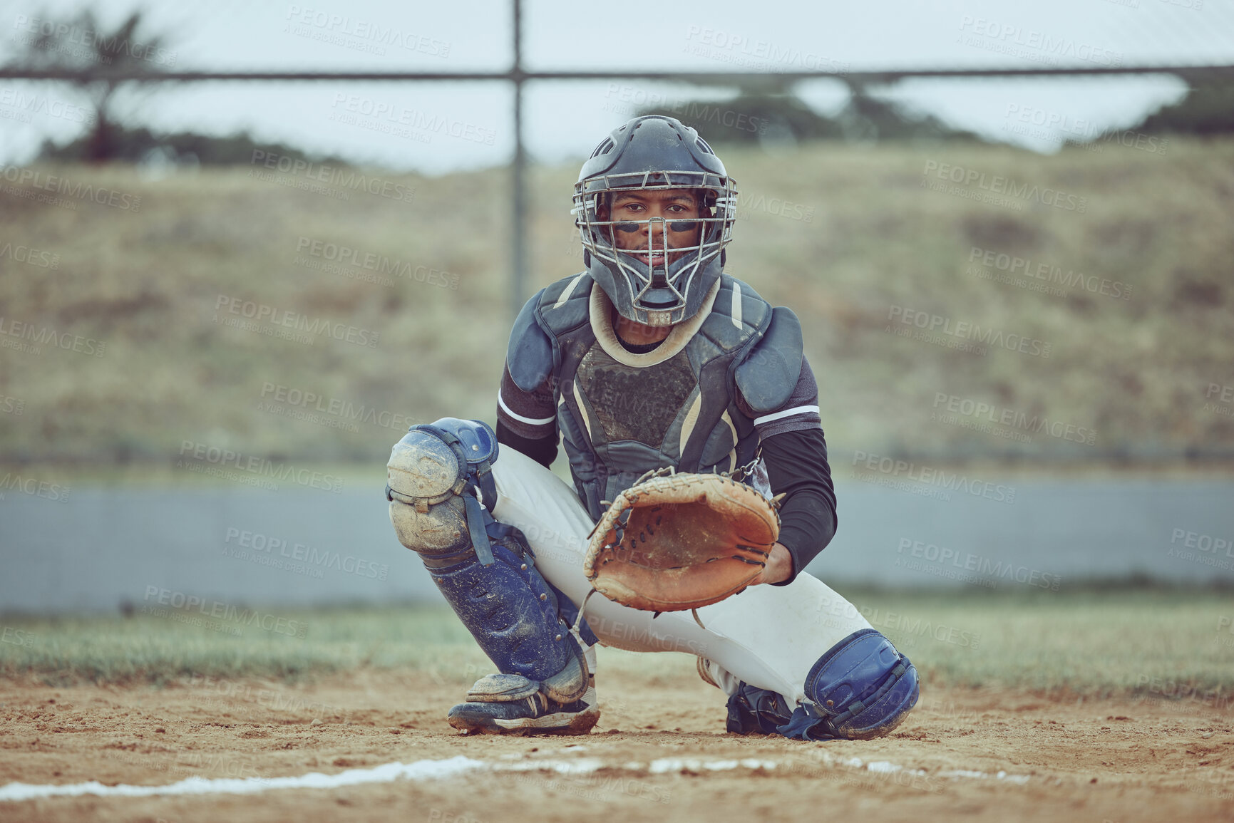 Buy stock photo Portrait african american pitcher ready to make a catch with a mitt on a baseball field. Young sportsman in a helmet ready for the ball. Black man athlete playing a game or match on pitch outdoors
