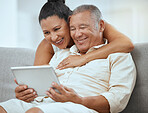 Senior couple, tablet and online in living room, social media news and ebook media app in Colombia home. Elderly retirement people, relax and digital social network, internet technology or connection