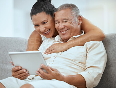 Buy stock photo Senior couple, tablet and online in living room, social media news and ebook media app in Colombia home. Elderly retirement people, relax and digital social network, internet technology or connection