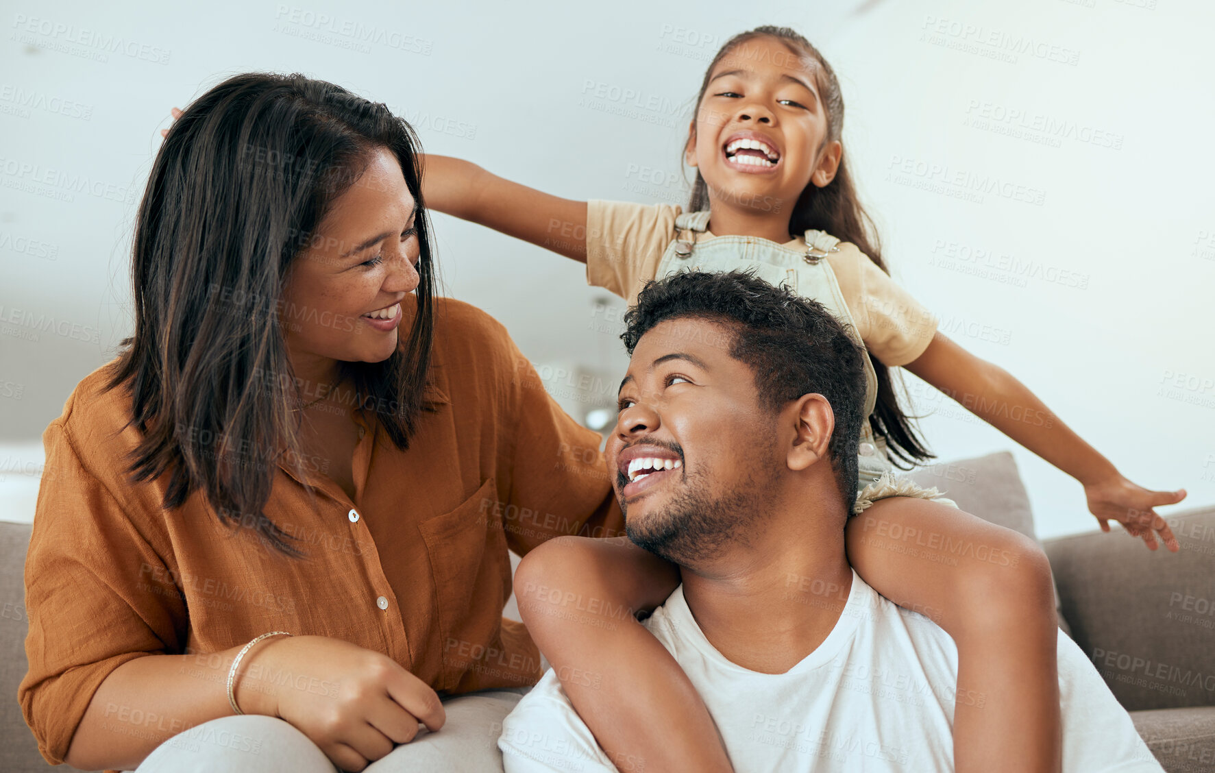 Buy stock photo Happy family, love and relax on a sofa in a living room, laughing and playing in their home together. Love, smile and happy girl having fun with parents, talking and enjoying a game with mom and dad