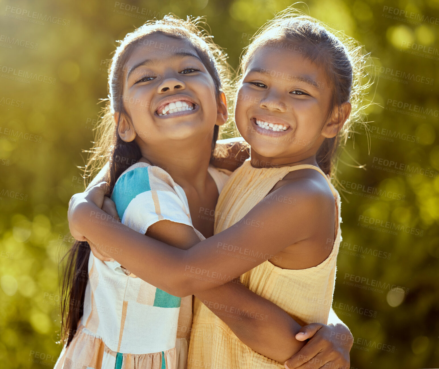 Buy stock photo Happy children, sisters and girl friends hug for love, care and bond in sun park, summer garden and backyard in outdoor Colombia. Big smile, funny and playful portrait of young kids hugging together 