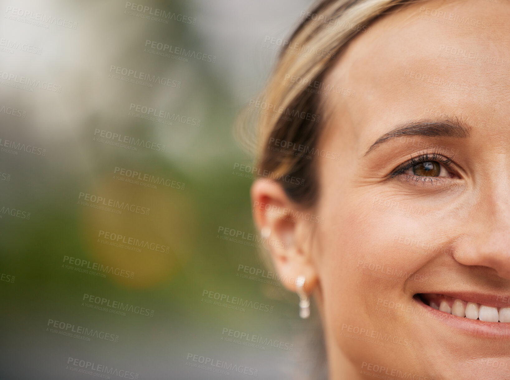 Buy stock photo Face, eye and mockup with a young woman outdoor next to a bokeh background for marketing or advertising. Happy, smile and product placement with an attractive female posing beside empty space