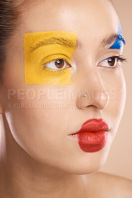 Buy stock photo Creative, cosmetic and woman with clown makeup in a studio for halloween, circus or face paint. Creativity, beauty and model with facial cosmetics for self expression, fantasy or art design in studio