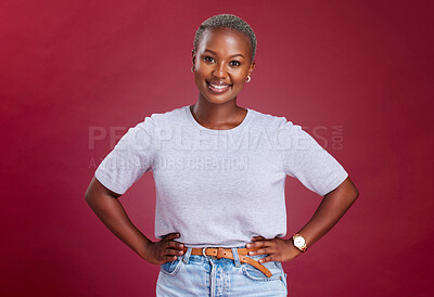 Buy stock photo Young, african woman and hands on hips in studio for beauty, fashion and style with happiness. Happy black woman, portrait pose or smile face against red background for cosmetics, makeup or glow skin