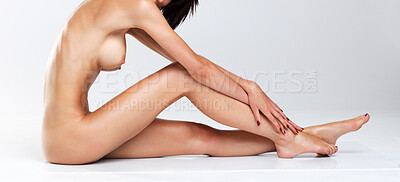 Buy stock photo Isolated nude woman seated in studio looking shyly at the camera
- copyspace