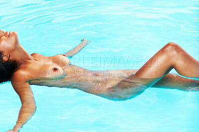 Buy stock photo Portrait of seductive mixed race woman relaxing in a swimming pool
