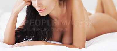 Buy stock photo Portrait of a sensual nude woman lying down on a bed
