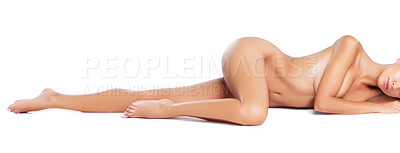 Buy stock photo A portrait of a nude model lying down lengthwise on the studio floor