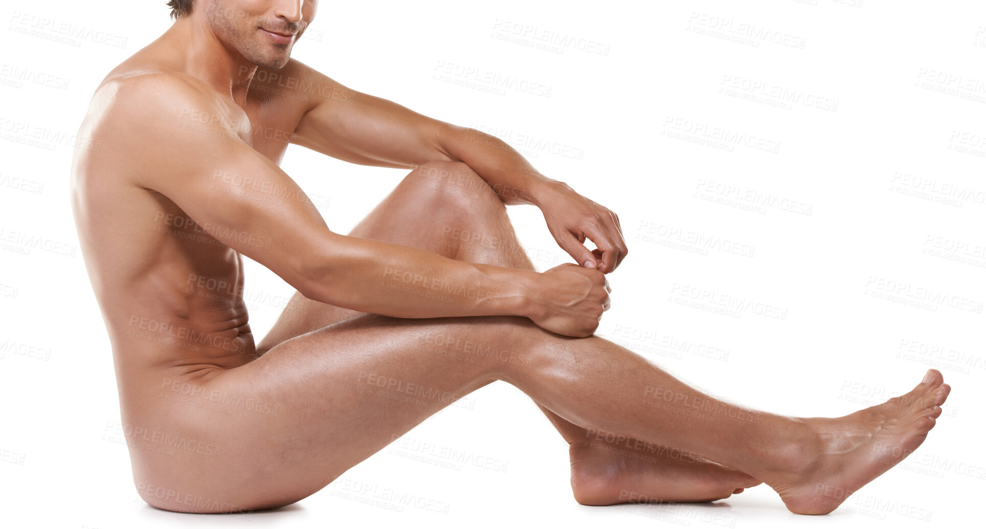 Buy stock photo Full length of a handsome naked man sitting against a white background