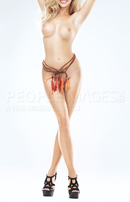 Buy stock photo A young woman posing naked with feathers around her waist