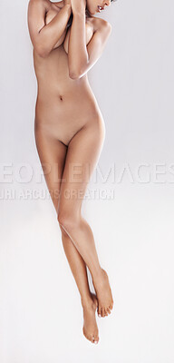 Buy stock photo Full length shot of a nude woman lying on her back