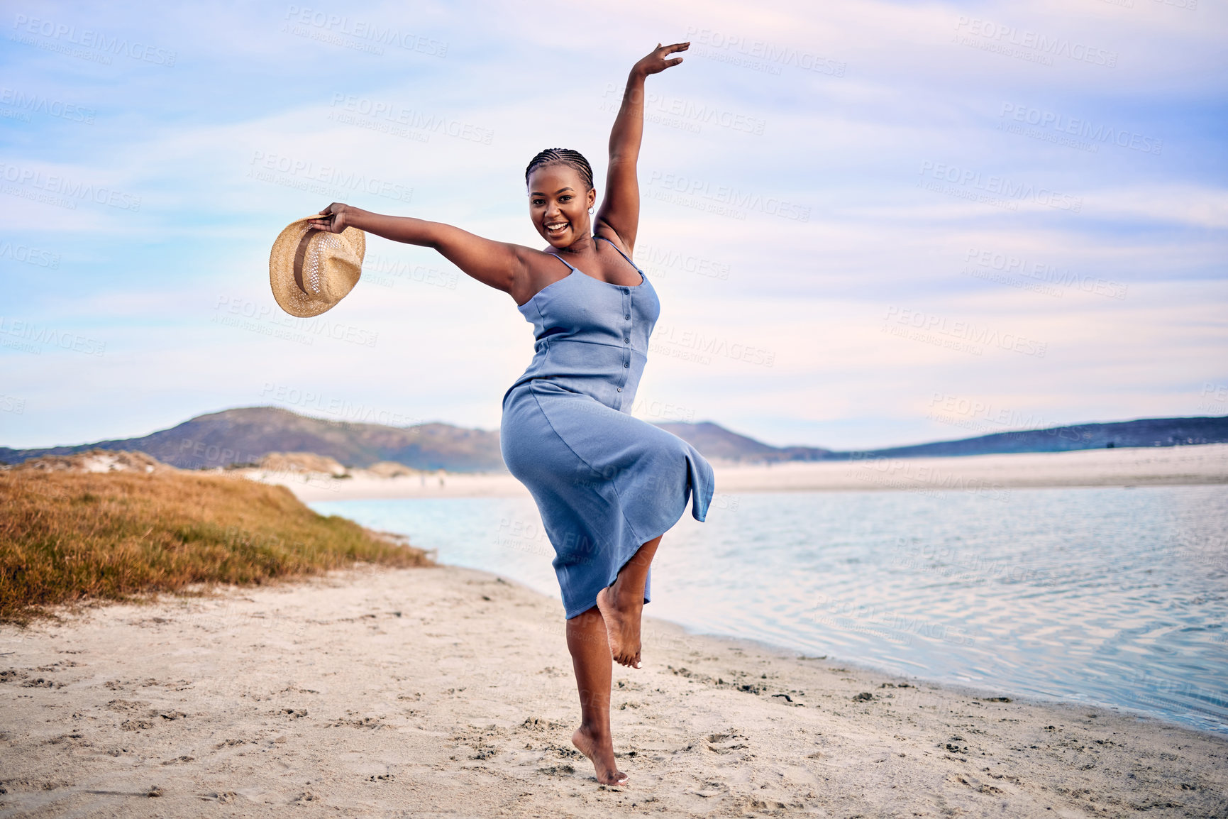 Buy stock photo Portrait, excited and black woman dancing, beach and movement with happiness, tropical island or sunset. Face, female person or girl outdoor, travel or seaside holiday for stress relief, dance or joy