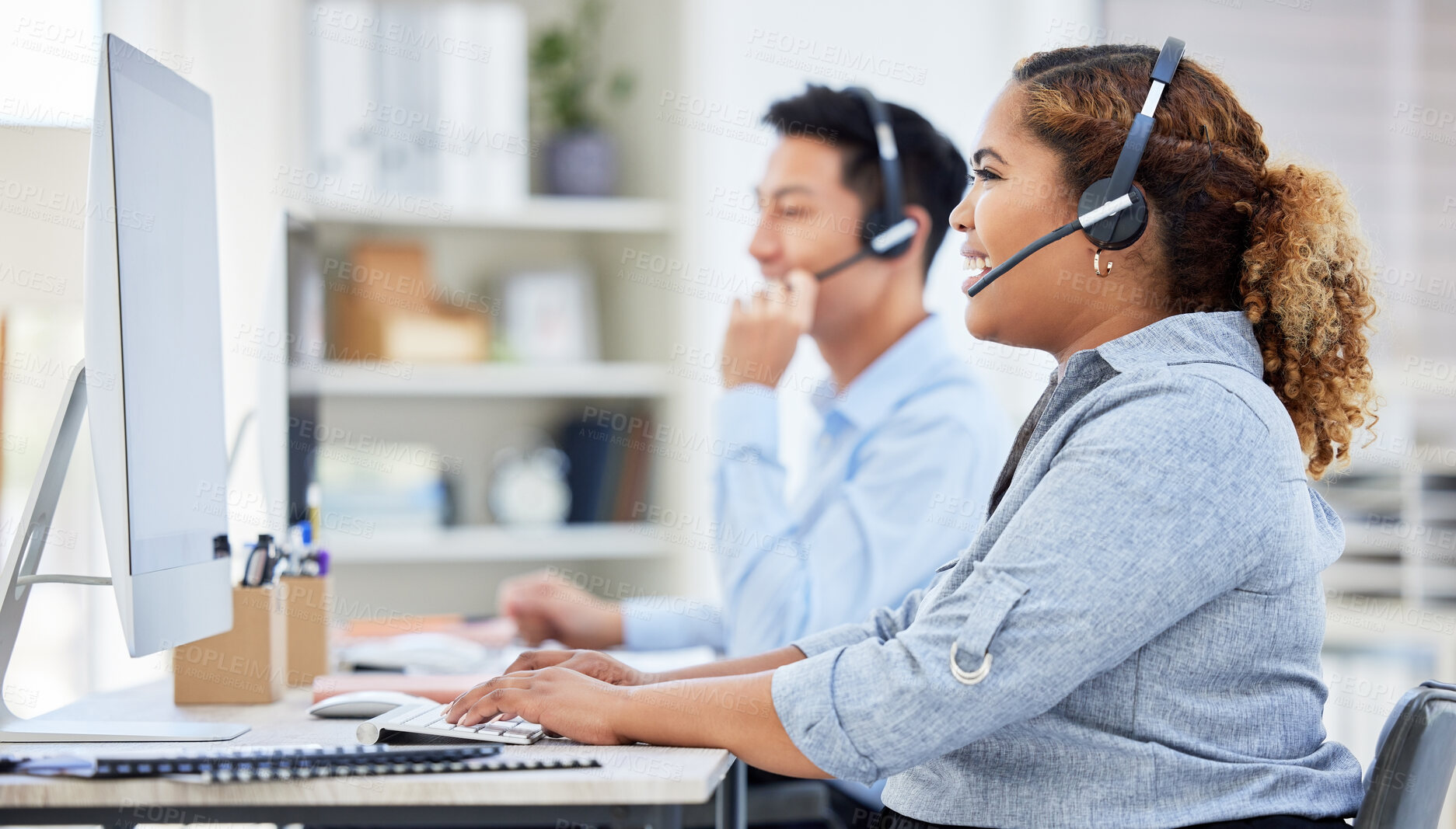 Buy stock photo Happy, confident and smiling call centre agent talking on a headset while working on computer in an office. Saleswoman or consultant operating a help desk for customer care and service support