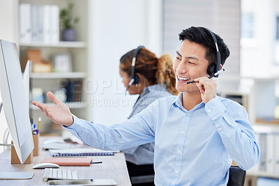 Happy, confident and helpful call centre agent talking on a headset while working on computer in an office. Salesman or consultant while operating a help desk for customer care and service support
