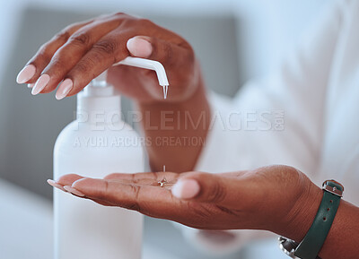 Closeup of beautiful female hands washing using hand sanitizer with care. African American lady cleaning her skin for health and wellness reasons. A woman with pretty nails using hygiene soap.