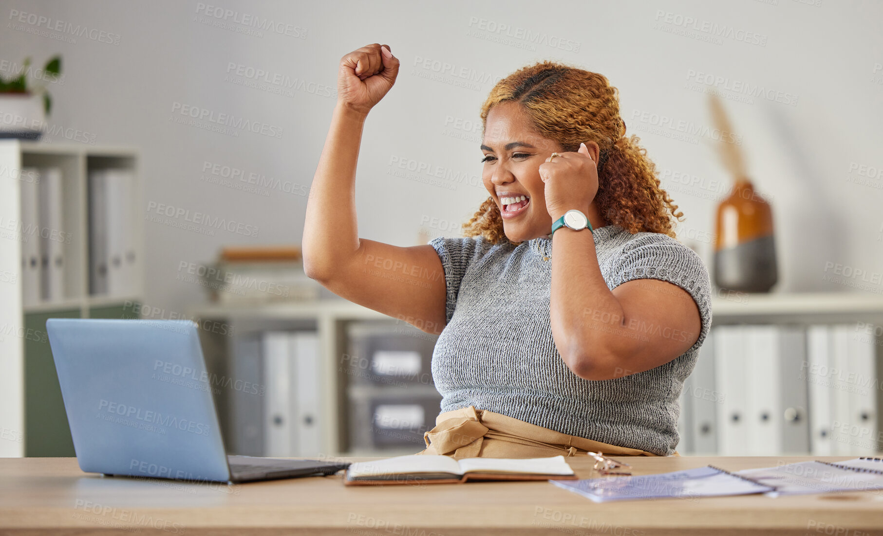 Buy stock photo Excited, happy and celebrating business woman cheering for success while working on a laptop in her office. Young entrepreneur, freelance or remote worker looking confident, cheerful and successful