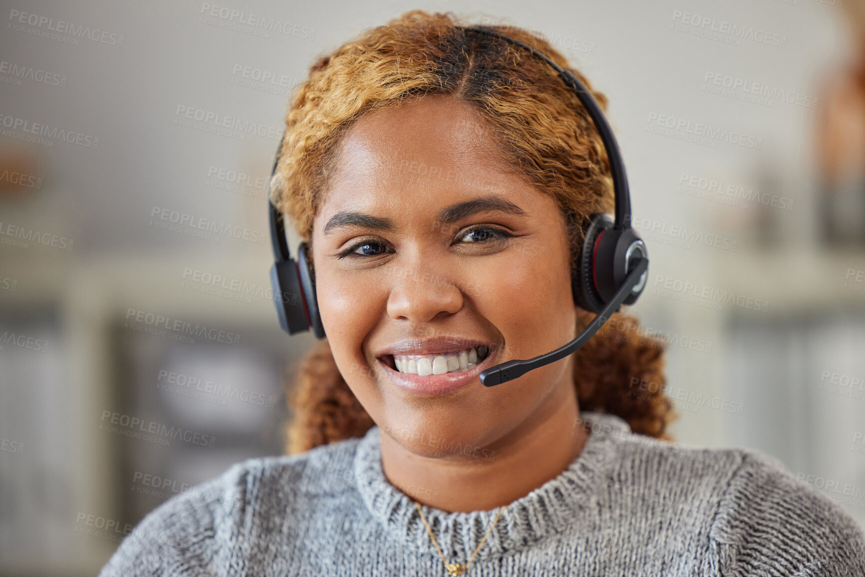 Buy stock photo African female call center agent smiling and happy to help in her office at work. Portrait of a young woman customer service employee looking excited and ready to support clients in her workplace