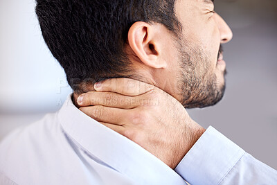 Stress, pain and sore neck rear closeup of businessman stretching strained muscle. Stressed corporate man suffering from a painful injury rubbing back. Feeling fatigue and unhappy with bad posture