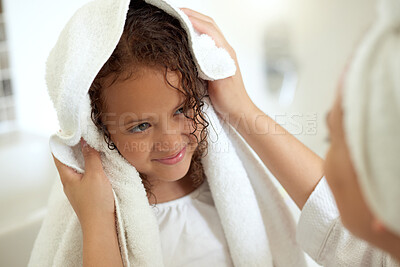 Buy stock photo Shower, hygiene and clean daughter bonding with caring, loving and kind mother. Single female parent drying her child with a soft, dry and white towel after a warm bath inside the bathroom at home