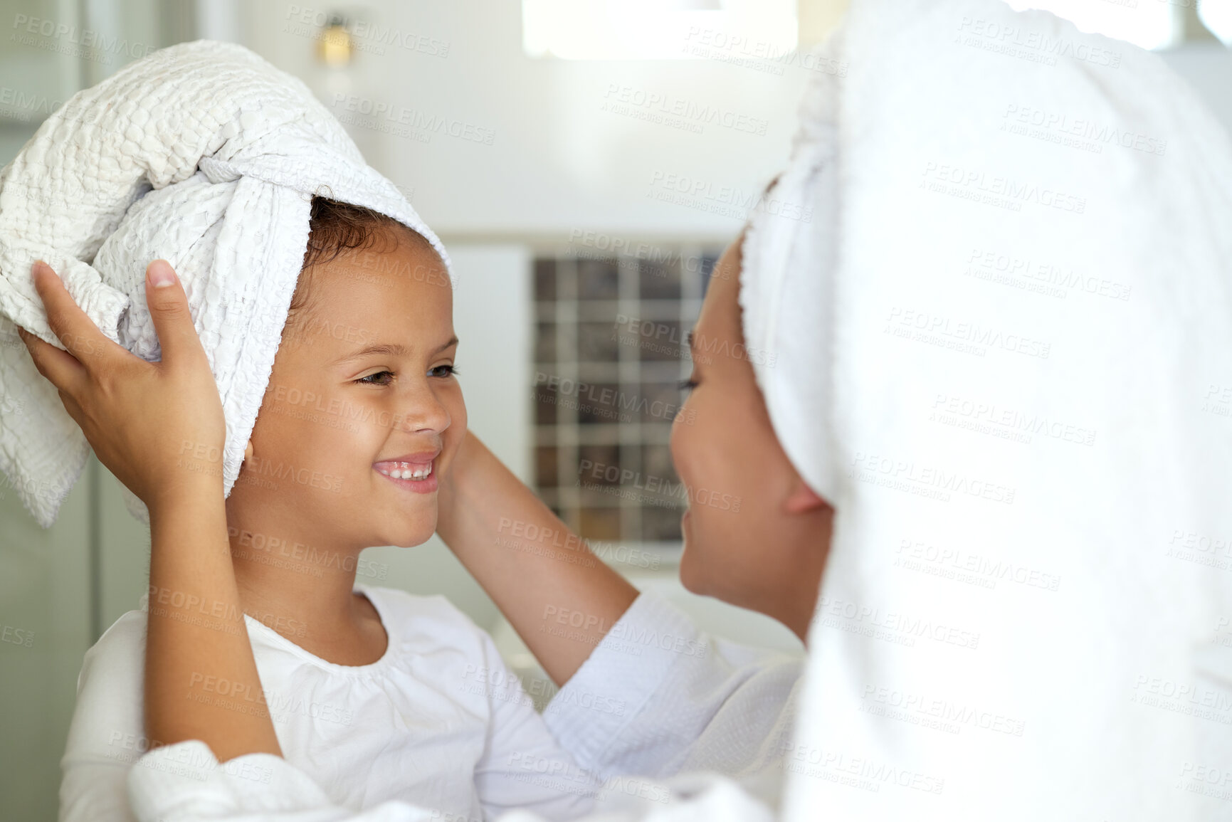 Buy stock photo Hygiene, washing hair and grooming with haircare routine for a mother and daughter home spa day. Happy, caring and sweet child and parent bonding over healthy skincare or relaxing pampering treatment