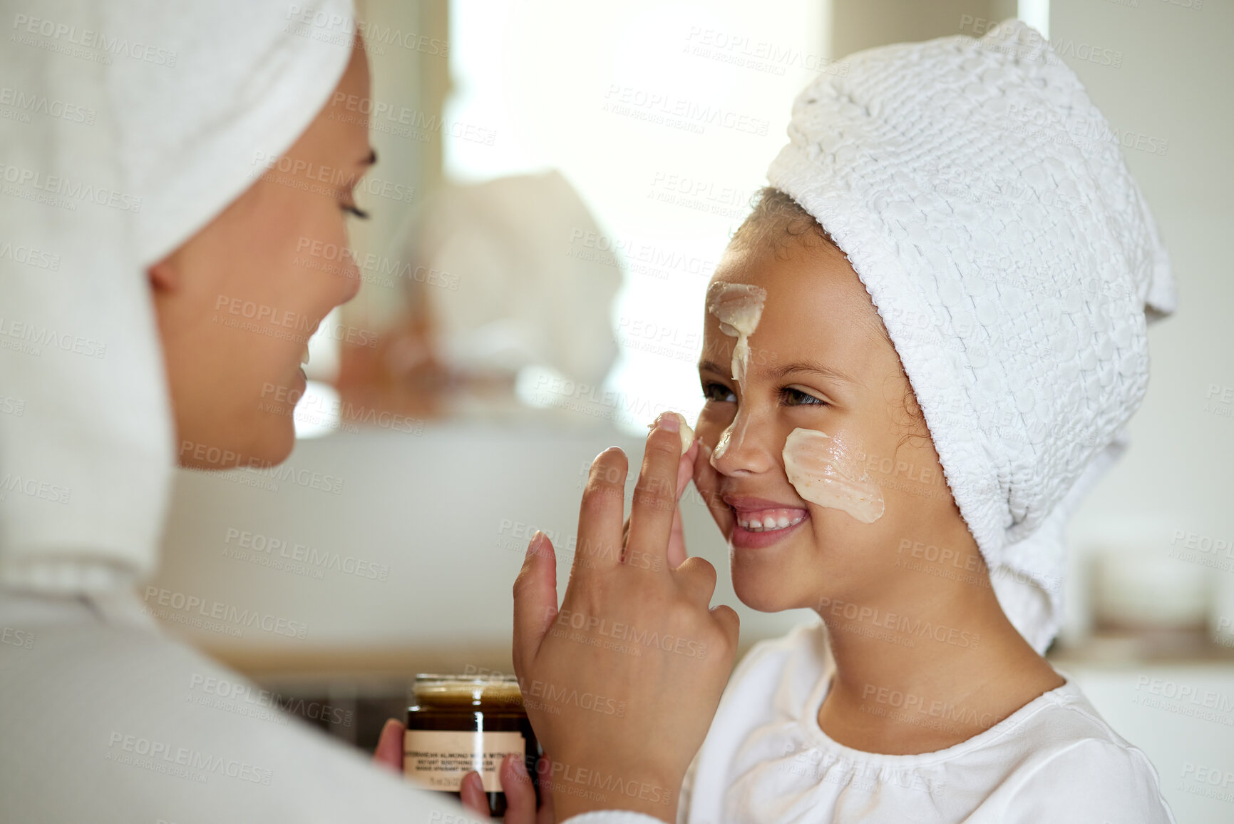 Buy stock photo Fresh skincare, face cream and healthy skin product for mother and daughter home spa day. Fun, smiling and playful child and a parent applying moisturizer for grooming routine or sunscreen protection