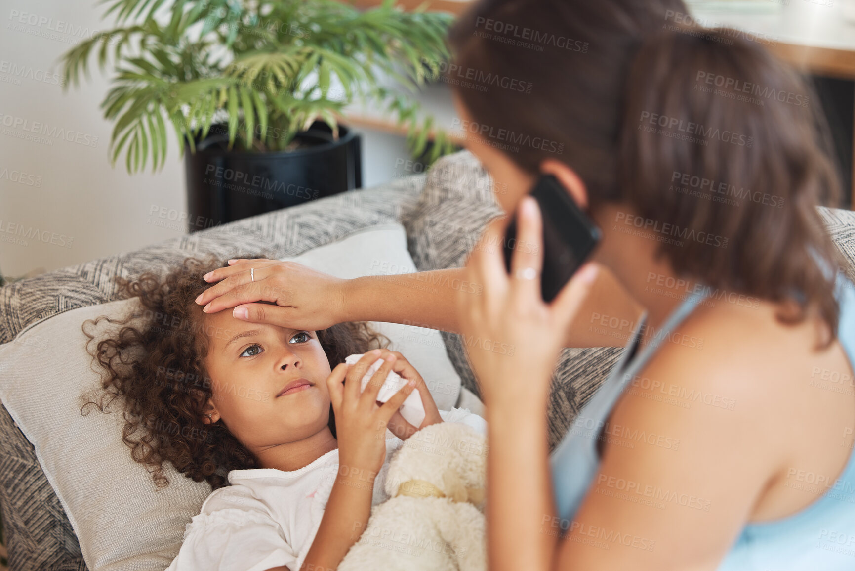 Buy stock photo Healthcare, family and sick little child suffering from fever, flu and cold and mother checking temperature of her ill son while calling a doctor. Kid lying on sofa showing signs of virus disease