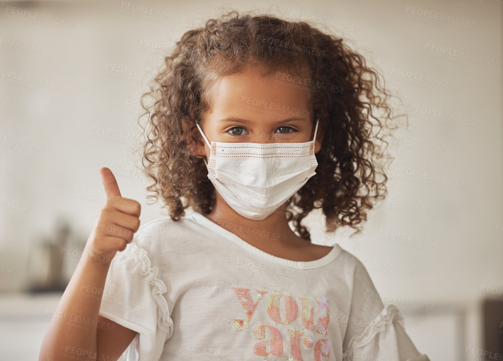 Buy stock photo Girl with a covid face mask and thumbs up like sign showing she is wearing protection or caution against virus, One brave and responsible little child with good OK gesture or success emoji expression