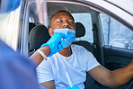 Covid testing and screening of a man driving in his car at a drive through station with medical nurse assistance. Guy getting virus treatment test while wearing a protective face mask to stop spread