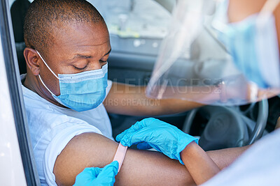 Buy stock photo Mobile covid vaccine service outdoors for a patient driving in a car. A healthcare professional applying a plaster on a patient in a vehicle after coronavirus treatment at a vaccination station