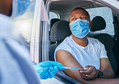 Buy stock photo Drive thru covid vaccine information service outdoors for a patient in a car. A healthcare professional giving a pamphlet to a man in a vehicle after coronavirus treatment at a vaccination station
