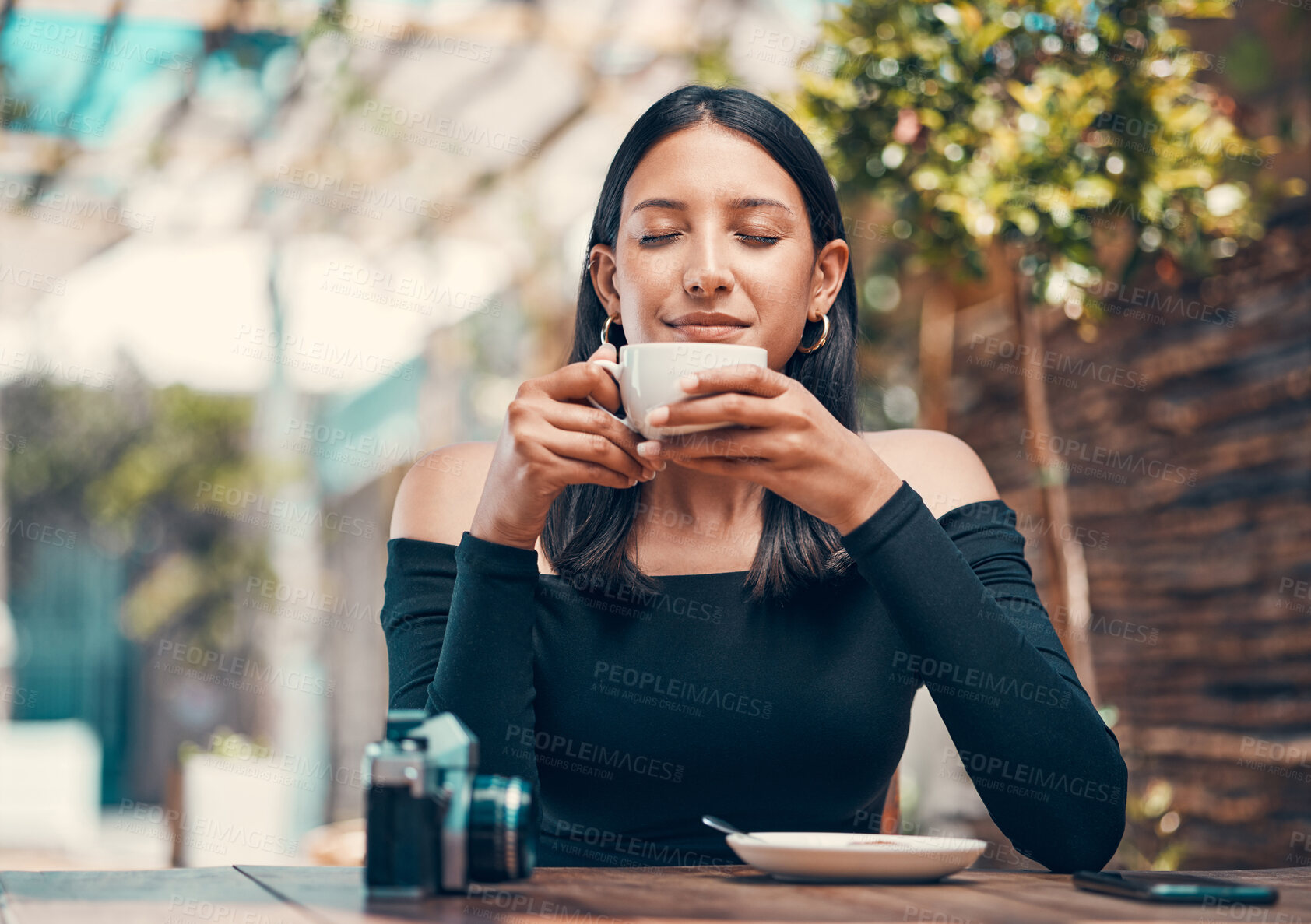 Buy stock photo Beautiful, happy and relaxed woman smelling fresh coffee and enjoying a morning in cafe. Calm, zen and content student drinking a warm, hot and comforting cup of beverage drink in relaxing restaurant