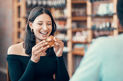 Buy stock photo Happy, beautiful and relaxed woman eating on a date at a restaurant with her partner on the weekend. Young and attractive female enjoying a meal or breakfast burger at a cafe with her boyfriend 