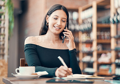 Buy stock photo Beautiful, young and friendly woman talking on the phone and writing in a dairy at a coffee shop. Confident freelancer booking appointments and smiling on call in a restaurant on a summer weekend