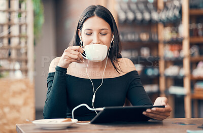 Beautiful, happy and relaxed student with tablet drinking coffee, listening to a podcast and music on earphones in a cafe. Woman online and watching distance learning education webinar in restaurant