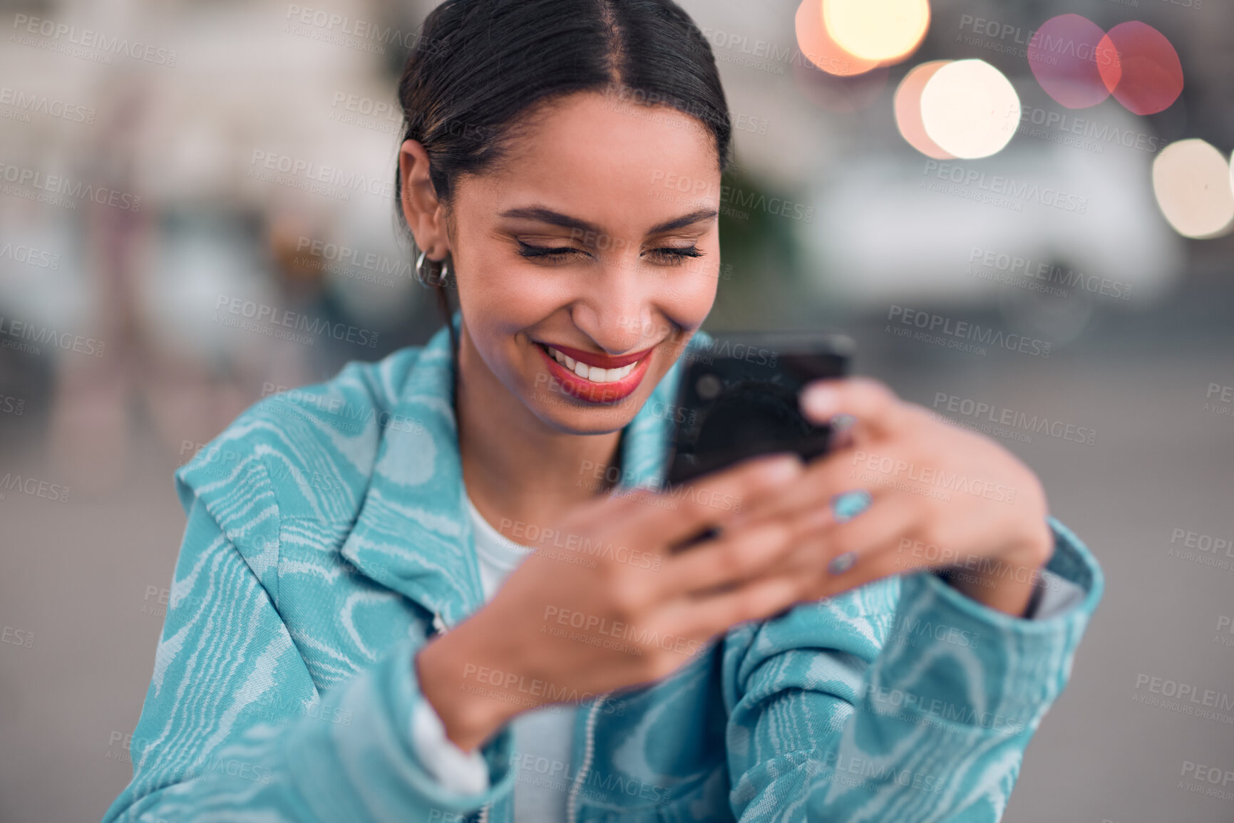 Buy stock photo Trendy, happy and modern woman texting on a phone, browsing social media or surfing the internet. Single female looking confident and relaxed, smiling while reading a message on an online dating app