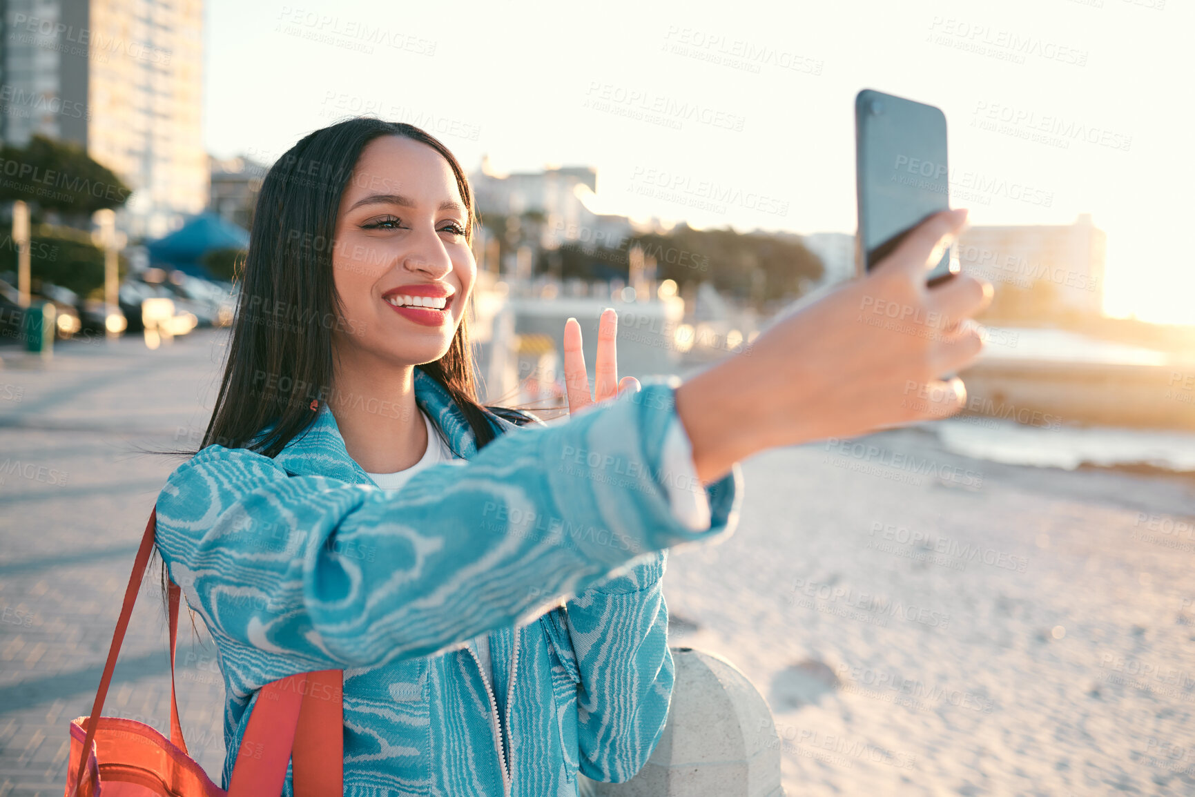 Buy stock photo Fun, happy and trendy student taking a selfie on phone for social media while exploring, visiting and enjoying city. Stylish, edgy and funky woman taking photos on vacation while sightseeing town