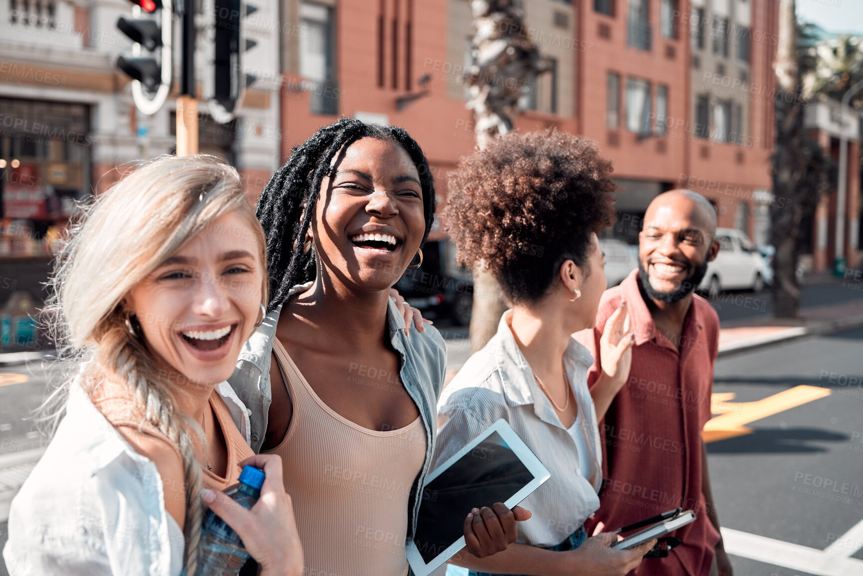 Buy stock photo A Group of diverse students having fun outdoors in the city on a sunny summer day. Portrait of young people or friends laughing and smiling together in an urban town while walking to campus