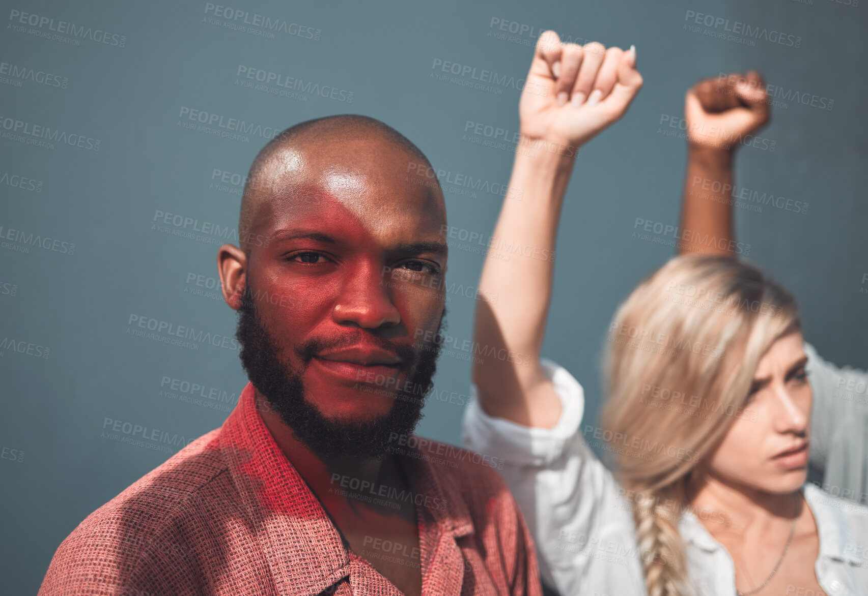 Buy stock photo Portrait of young, african american man standing together  with protesters, holding fists, showing strong striking gesture in support Social justice human rights issues movement stands in unity 