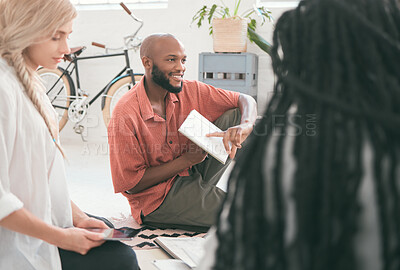 Buy stock photo Group of students brainstorming for school project or business people presenting ideas, taking notes in a book and digital tab. Diverse team talking or discussing and studying for an exam.