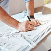Male architect hands and arms drawing building project or construction ...