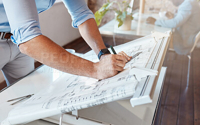 Buy stock photo Architect drawing a plan for a building project inside his office. Closeup of a male engineer doing a blueprint sketch at an architecture company or his workplace. Housing planner making a diagram