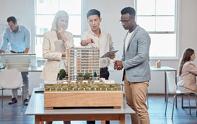 Buy stock photo Diverse architects or project managers discuss floor plan of building expansion. Asian engineer presents blueprint and 3D model for a new office to Caucasian and African American clients.