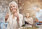 Thumbs up, happy and finger being shown by a business woman, manager or ceo while standing in an office at work. Cheerful, pleased and satisfied female showing a thumb in approval, agreement or like