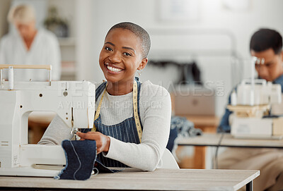 Buy stock photo Happy, creative black fashion student or designer sitting and smiling in class by a sewing machine working on clothes. Isolated portrait of beautiful African American tailor in a factory or studio.