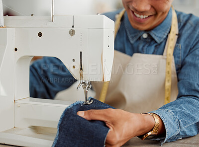 Design student, creative and worker in a studio sewing clothes and garments. Fashion student learning sewing machine skills in a textile and manufacturing studio. Happy trainee practicing his craft