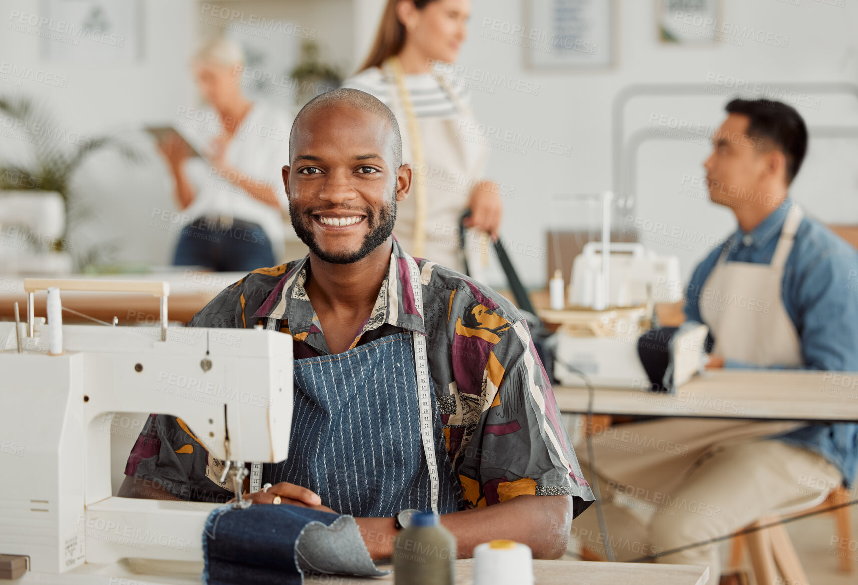 Buy stock photo Fashion designer, young man and creative in a workshop stitching clothes. Portrait of a happy, smiling and cheerful factory worker at a sewing machine in a textile startup and manufacturing studio