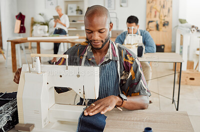 Buy stock photo Fashion designer, young man and creative student in a workshop to sew clothes and garments. Factory worker, tailor and apprentice learning sewing machine skills in a textile and manufacturing studio