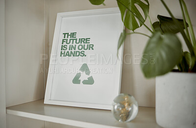 Buy stock photo Sustainable, sustainability and recycling sign near a green pot plant. Display of reuse and reduce frame picture on a cupboard of a home or house. The future is eco friendly and clean nature