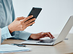 Modern businesswoman texting on laptop and phone while working, reading and planning strategy indoors. Closeup of a productive corporate worker multitasking on multimedia technology and app software