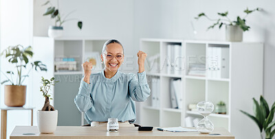 Celebrating, happy and smiling businesswoman looking cheerful, joyful and excited after reaching savings target at work. Portrait of female professional cheering for success after achieving a goal